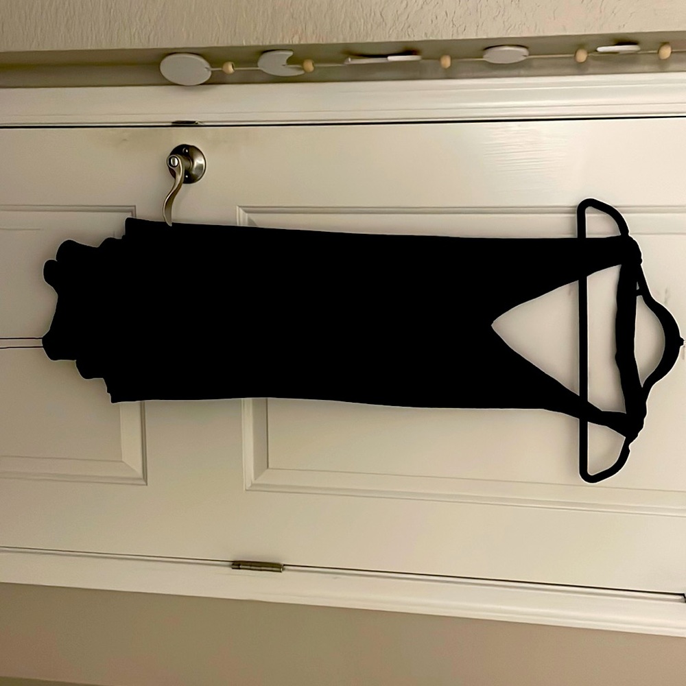 Black Free People halter top with decorative tie in the back.